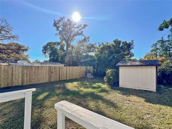 a view of a backyard of the house