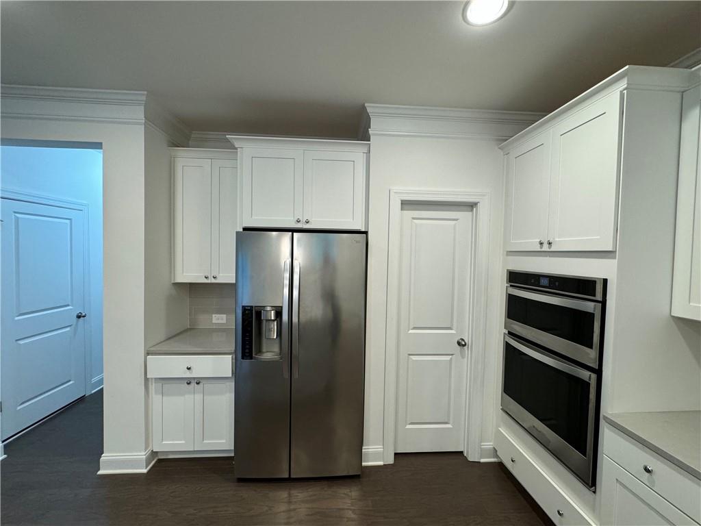 210 Hamlet Drive Duluth, GA 30097 - Photo 13 of 39 a kitchen with cabinets and stainless steel appliances