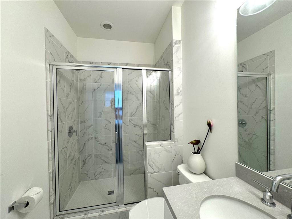 210 Hamlet Drive Duluth, GA 30097 - Photo 15 of 39 a bathroom with a shower and toilet