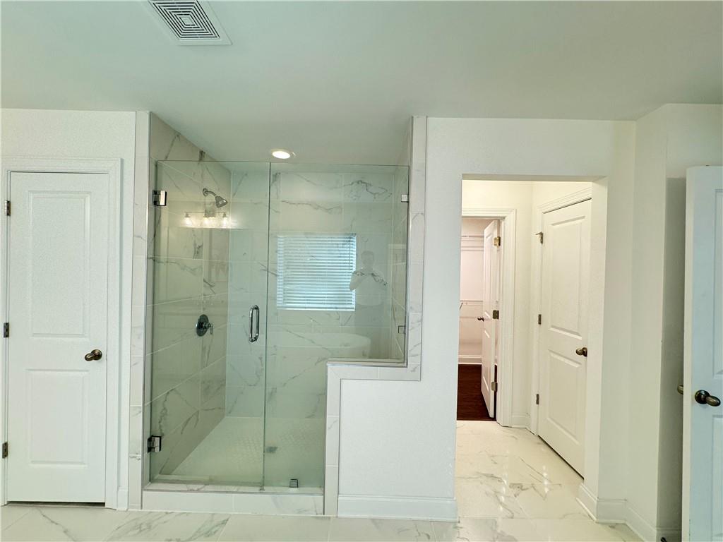 210 Hamlet Drive Duluth, GA 30097 - Photo 23 of 39 a bathroom with a shower and a sink