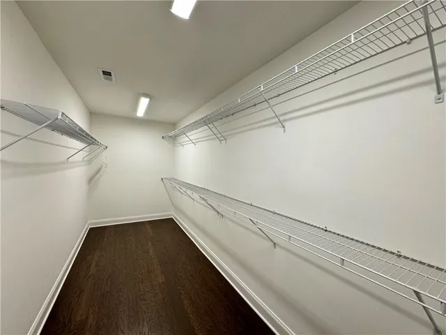 a bathroom with a toilet and a bathtub