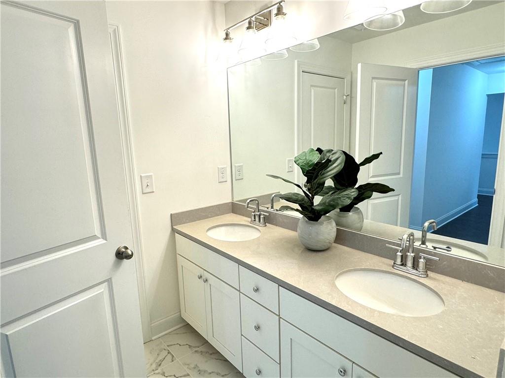 210 Hamlet Drive Duluth, GA 30097 - Photo 27 of 39 a bathroom with a granite countertop sink and a mirror