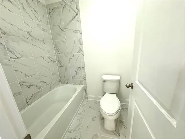 a view of a pathway both side of house