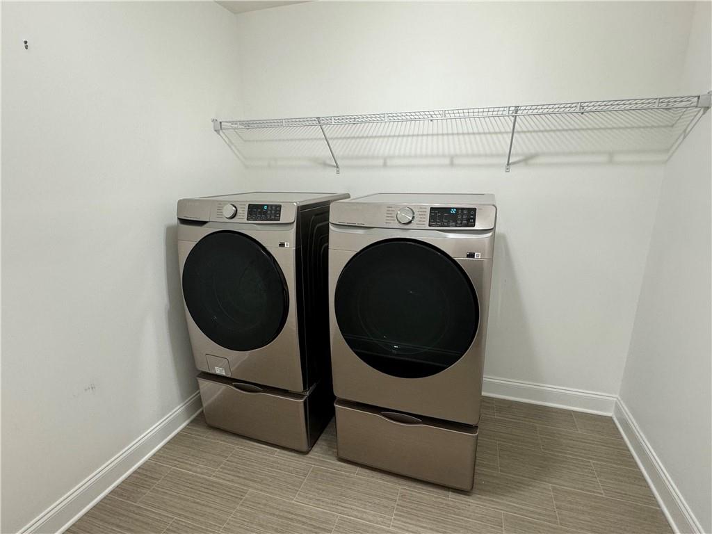 210 Hamlet Drive Duluth, GA 30097 - Photo 29 of 39 a utility room with dryer and washer