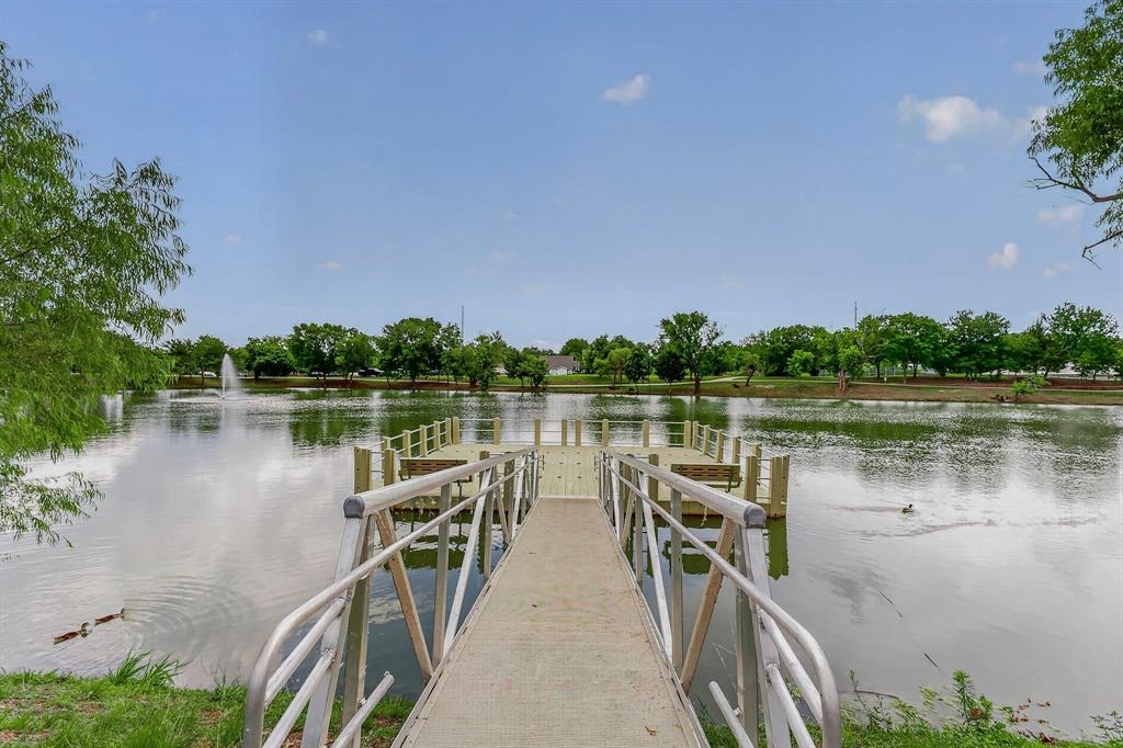 304 East County Line Road Royse City, TX 75189 - Photo 34 of 38 Private dock featuring a concrete ramp and aluminum railings leading to a wooden platform
