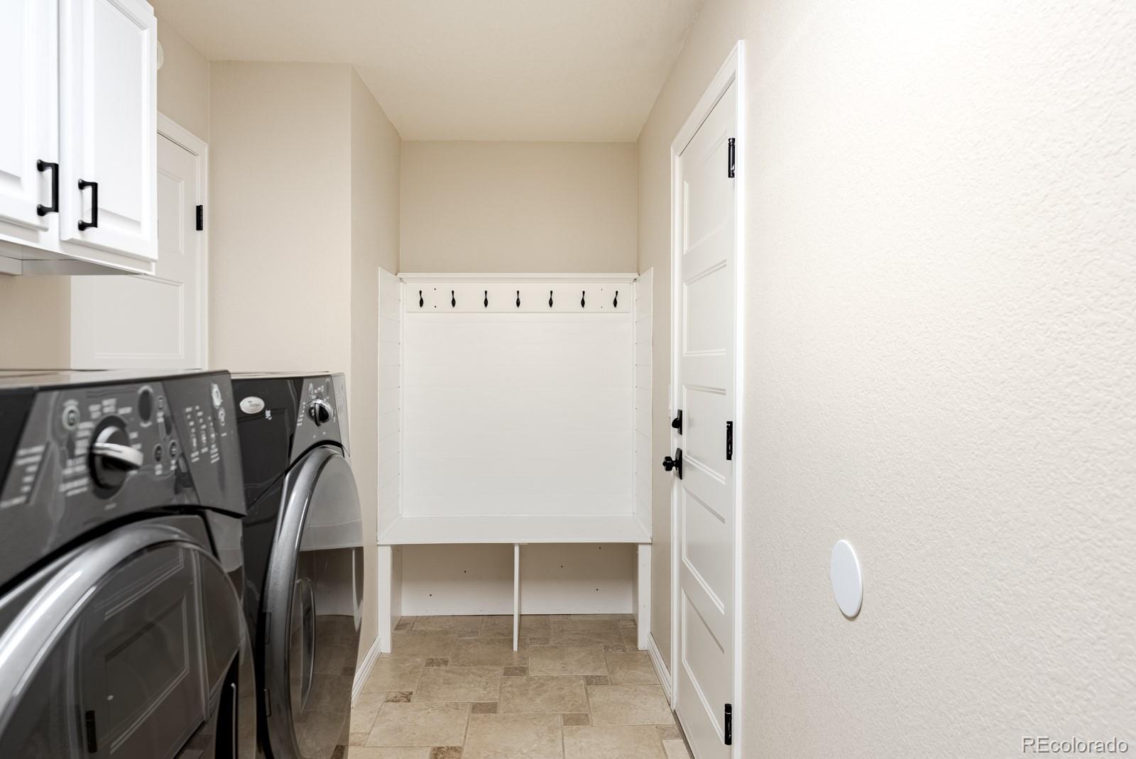 1914 Terrace Drive Highlands Ranch, CO 80126 - Photo 35 of 47 a view of walk in closet with clothes and shoes