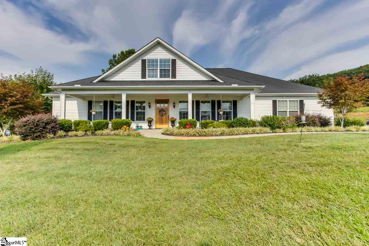 111 Trammell Road Travelers Rest, SC 29690 - Photo 1 of 36 This is the view from the front of the home coming up the driveway. The 4 car plus shop is to the right of the home There is also an attached 2 car garage. This home includes 10.3 acres with a private pond, pool shop and so much more.