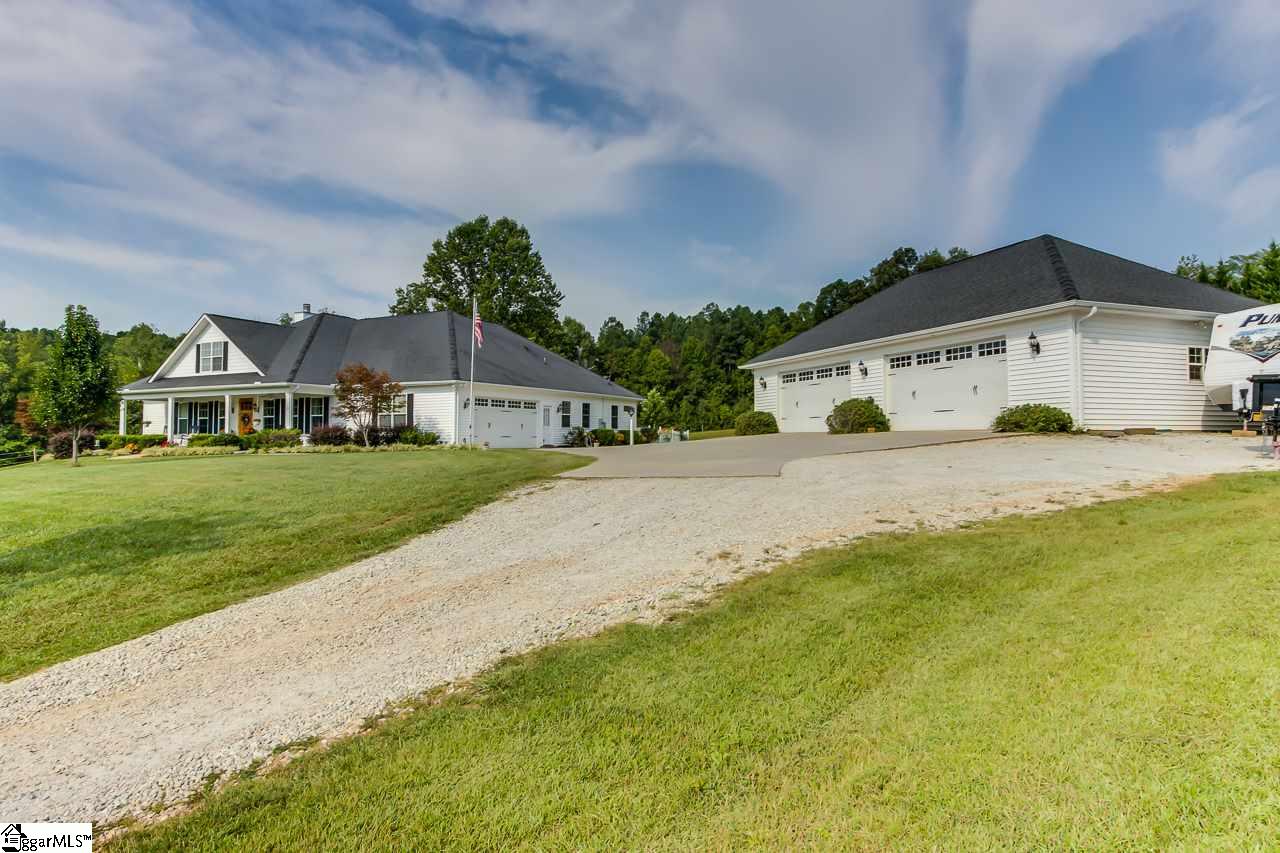 111 Trammell Road Travelers Rest, SC 29690 - Photo 2 of 36 This is another view of the home as you come up the driveway, this view includes the 4 car plus shop to the right. The shop has water and electric.
