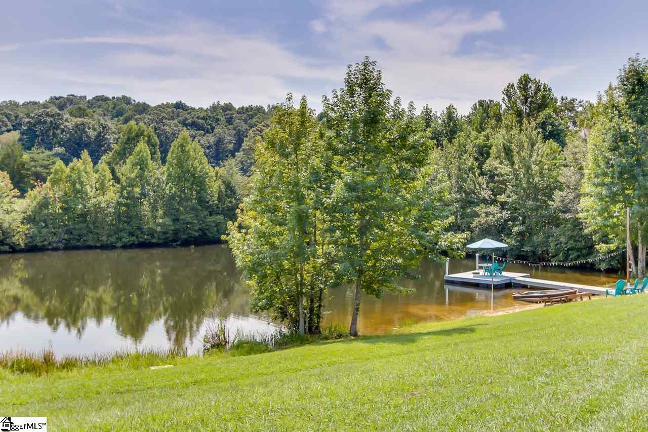 111 Trammell Road Travelers Rest, SC 29690 - Photo 33 of 36 This is a private 1 plus acre pond on the property. The pond is stocked and has been very well managed to maintain the ecology of the pond. There is a private beach and dock for all to enjoy.