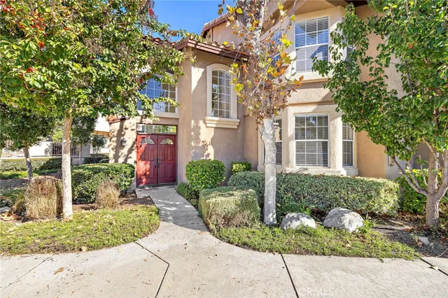 a front view of a house with garden