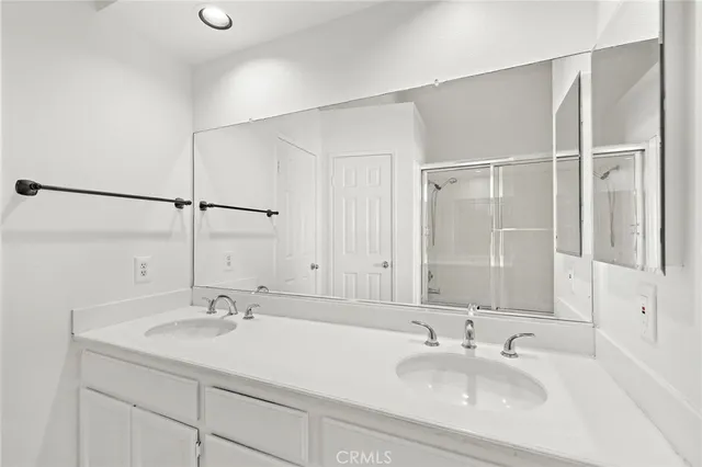 a bathroom with a sink and a large mirror