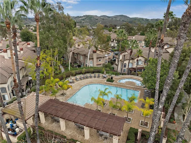 a view of a swimming pool with a yard