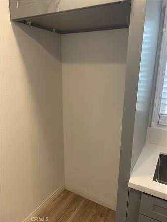 a view of small space with wooden floor