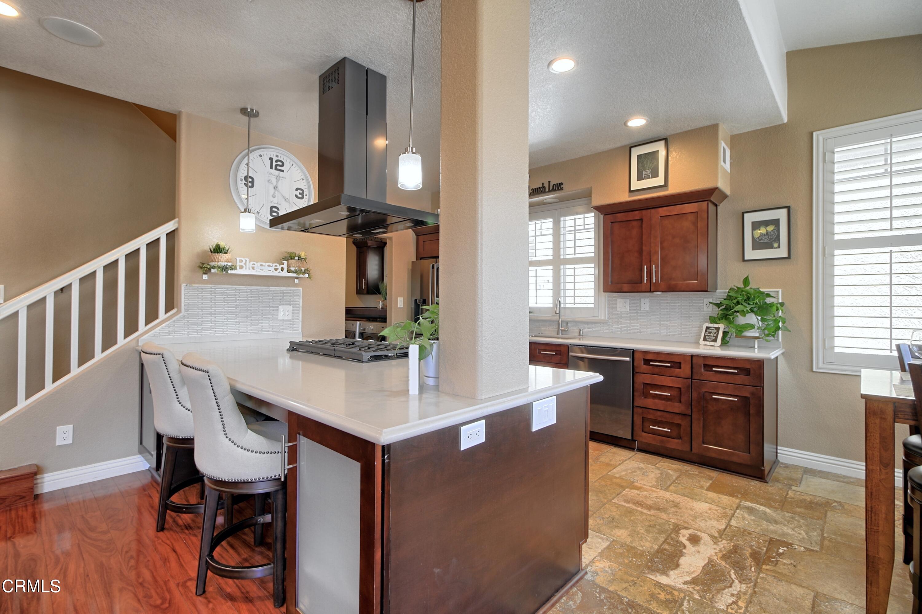 2062 Avila Place Oxnard, CA 93036 - Photo 11 of 52 a view of kitchen with cabinets and wooden floor