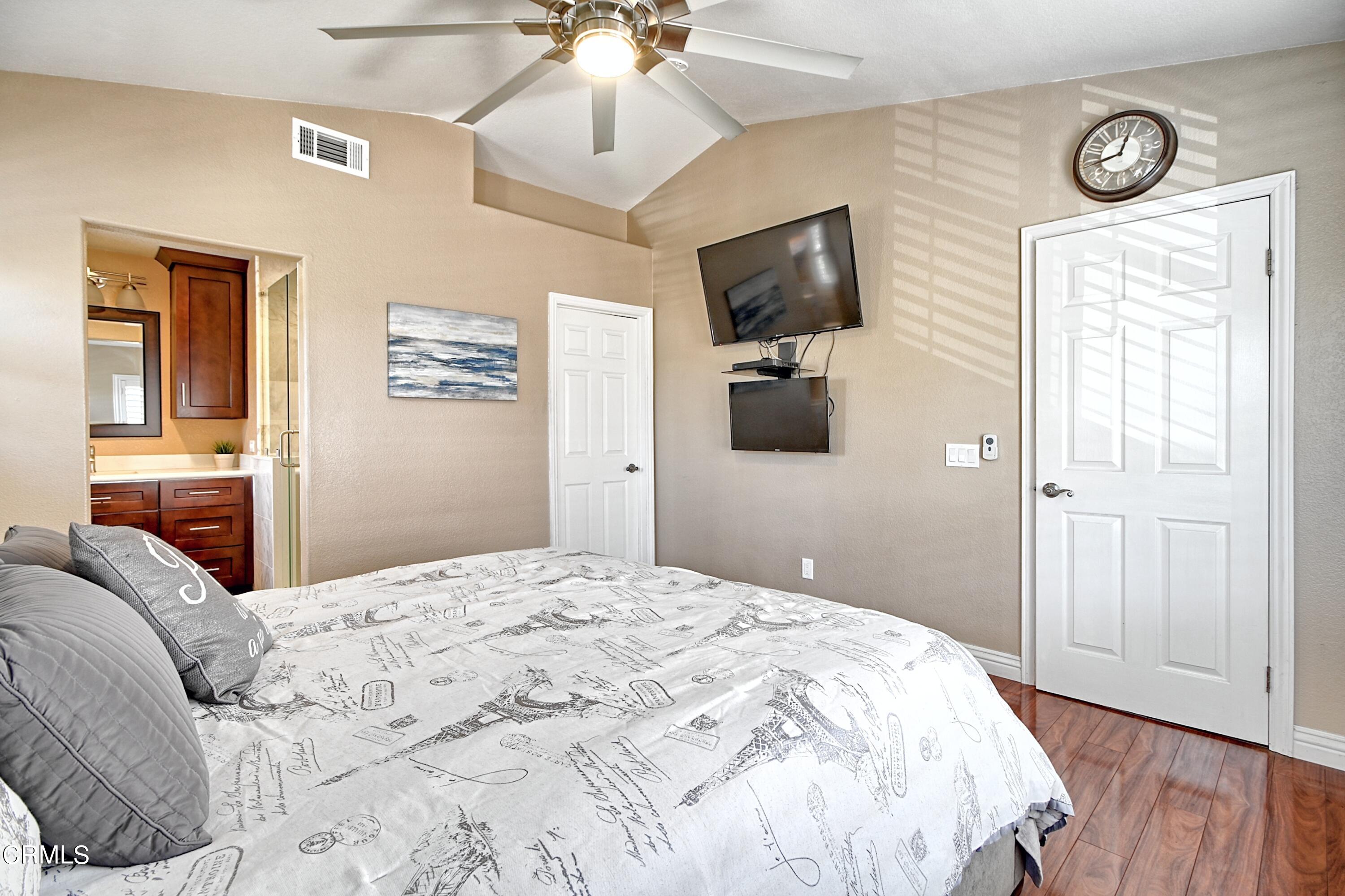 2062 Avila Place Oxnard, CA 93036 - Photo 19 of 52 a bedroom with a bed and a flat screen tv