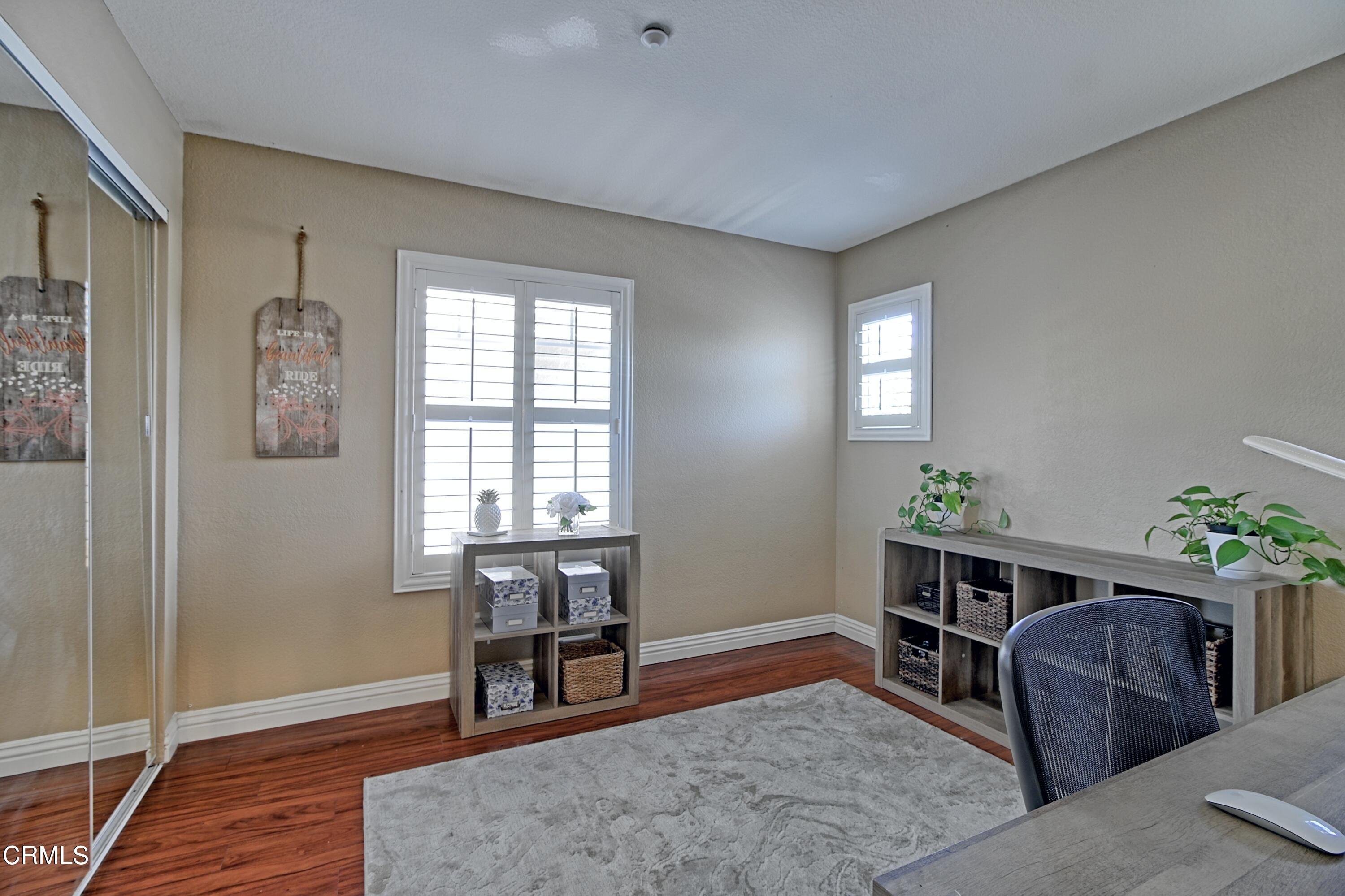 2062 Avila Place Oxnard, CA 93036 - Photo 21 of 52 a workspace with furniture window and wooden floor