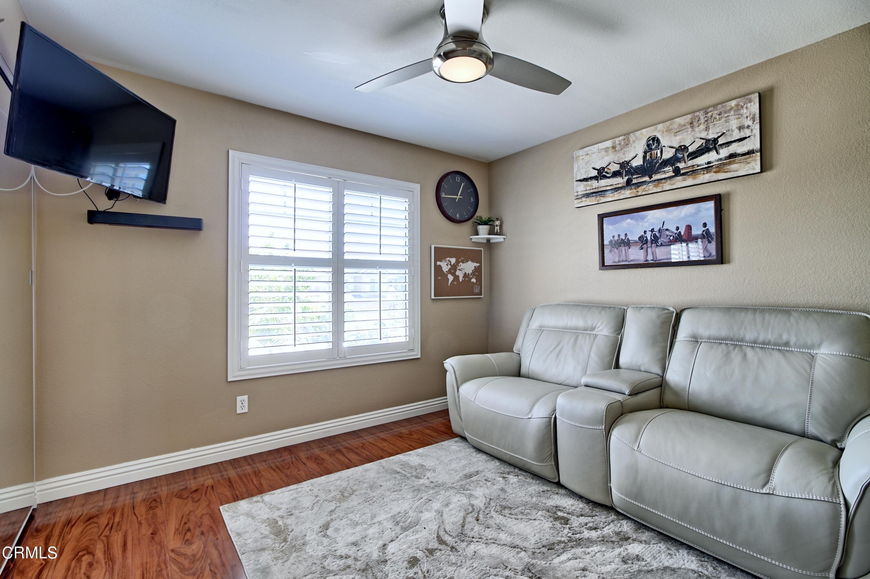 2062 Avila Place Oxnard, CA 93036 - Photo 24 of 52 a living room with furniture and a flat screen tv