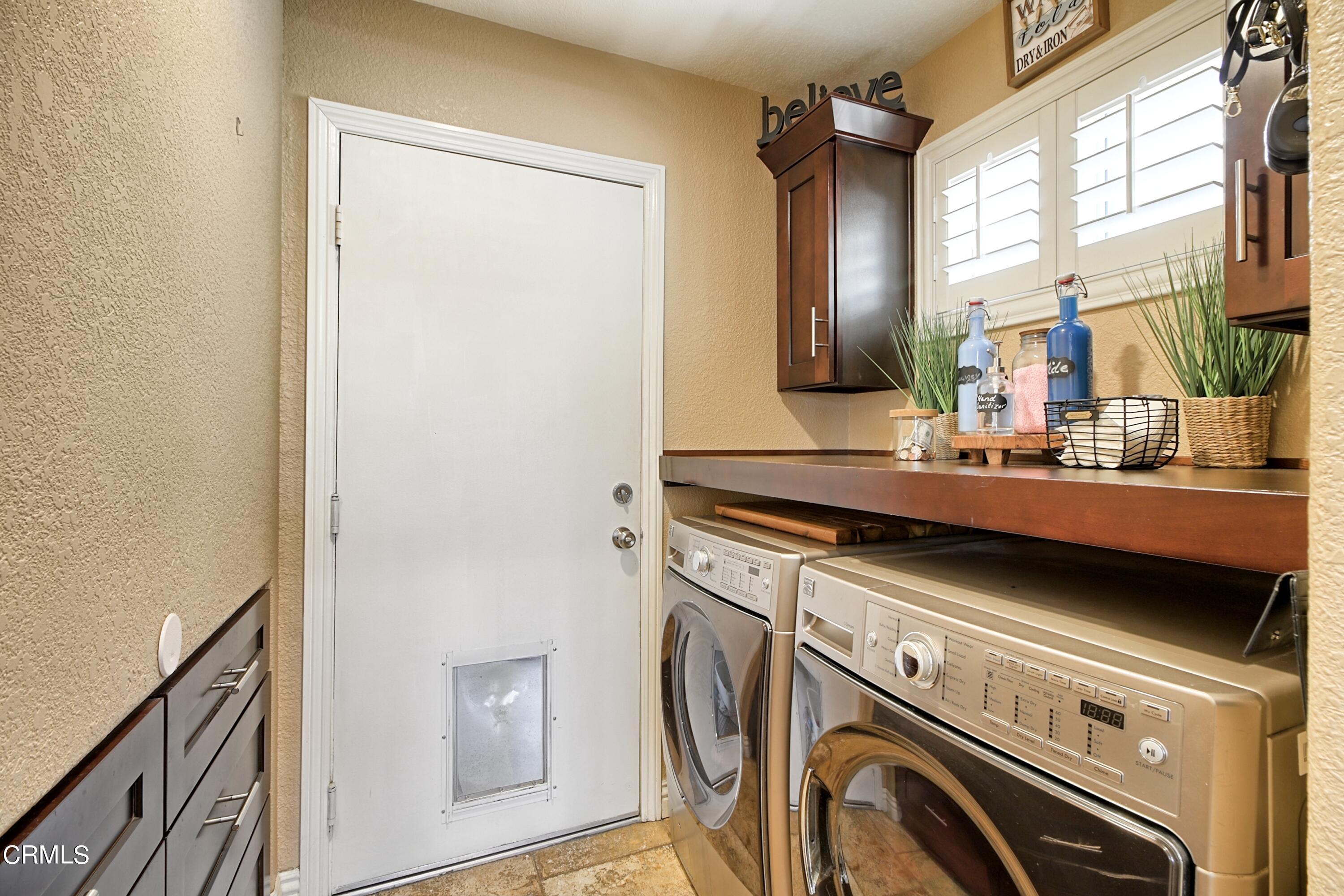 2062 Avila Place Oxnard, CA 93036 - Photo 26 of 52 a view of a storage and utility room with washer and dryer