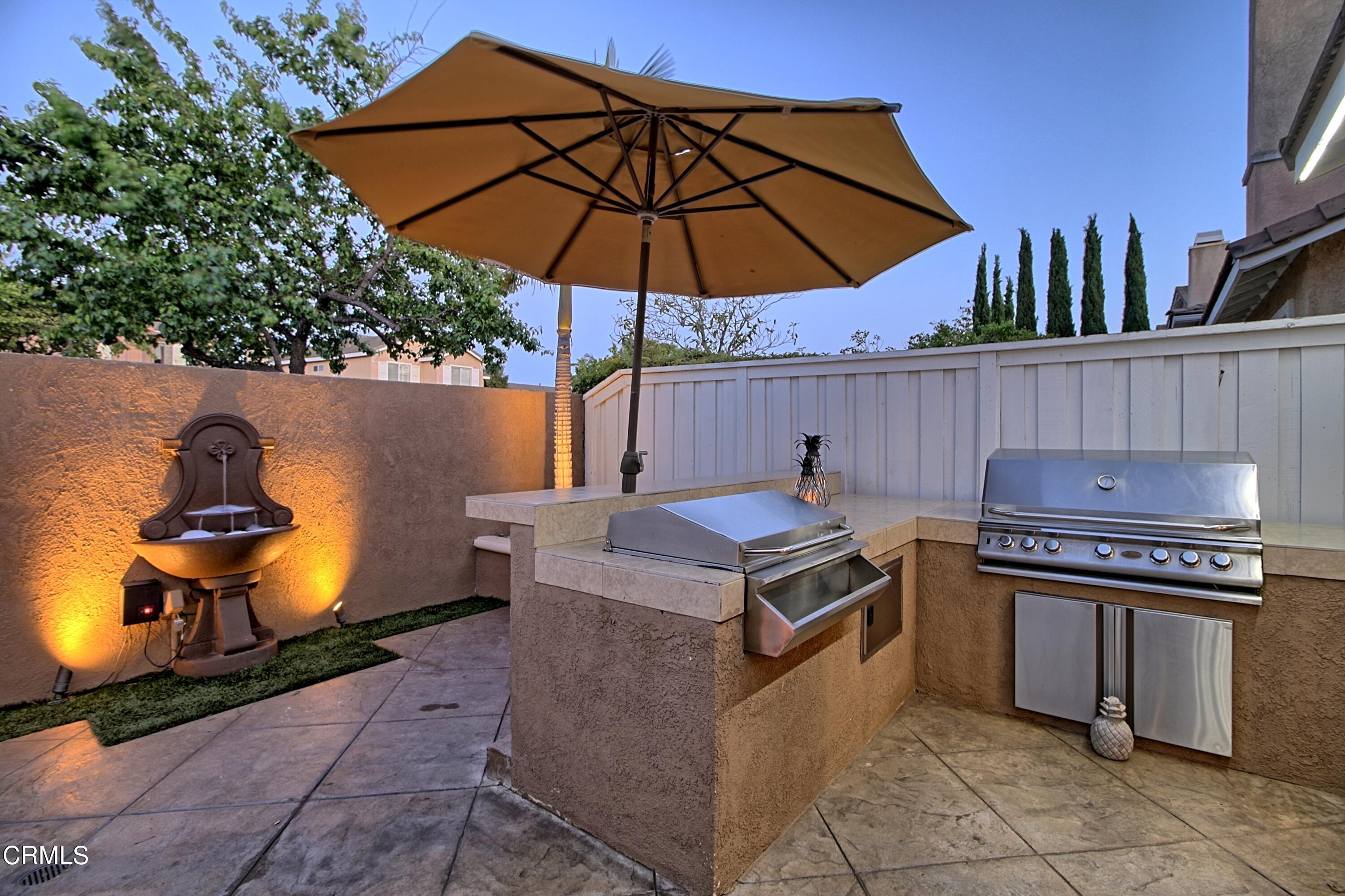 2062 Avila Place Oxnard, CA 93036 - Photo 35 of 52 a kitchen with a stove and a microwave oven