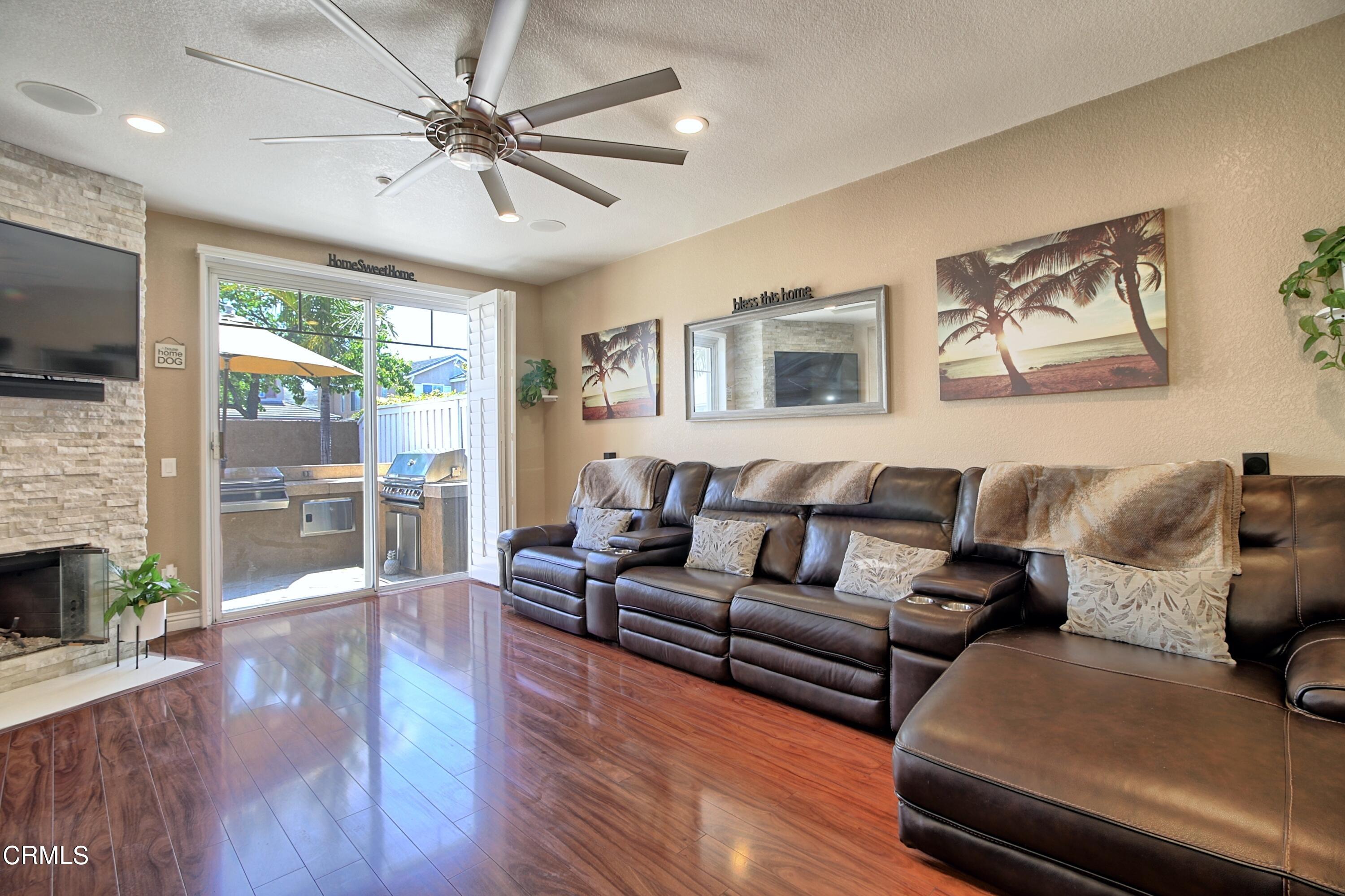 2062 Avila Place Oxnard, CA 93036 - Photo 8 of 52 a living room with furniture fireplace and a flat screen tv
