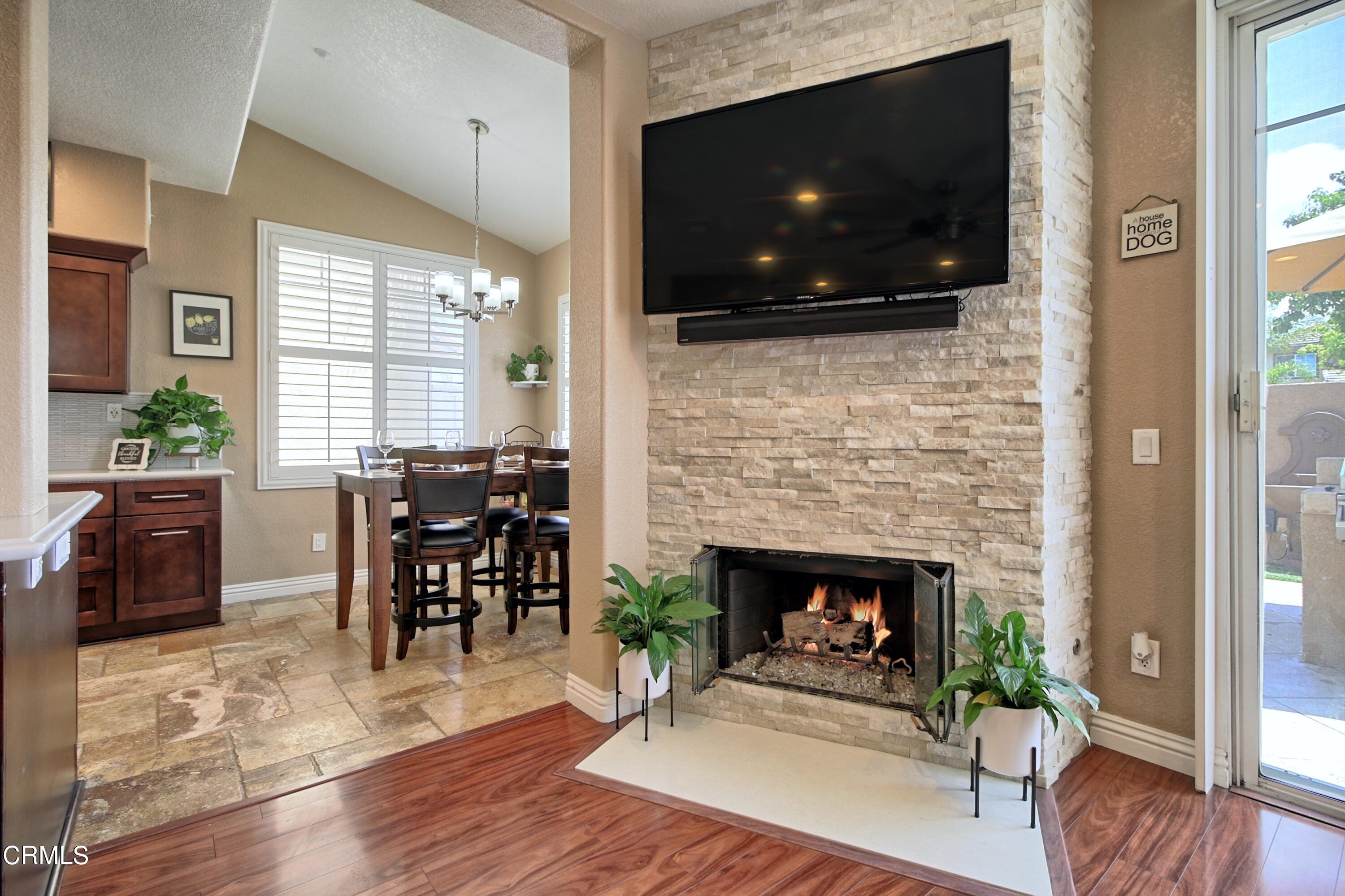 2062 Avila Place Oxnard, CA 93036 - Photo 9 of 52 a living room with furniture a flat screen tv and a fireplace