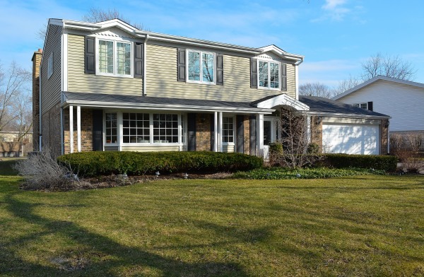 1833 Clover Road Northbrook, IL 60062 - Photo 1 of 25 a front view of a house with a yard