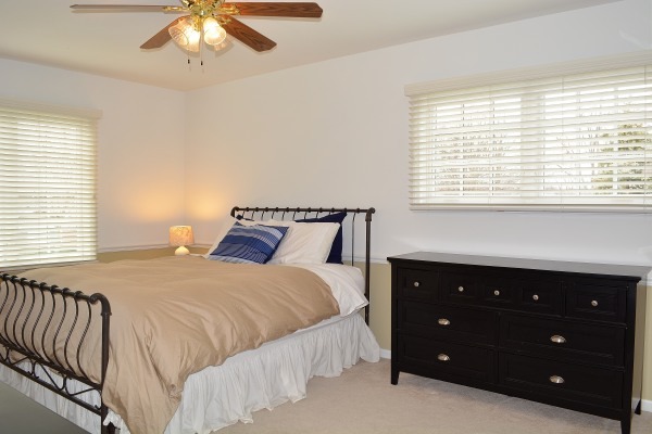 1833 Clover Road Northbrook, IL 60062 - Photo 15 of 25 a bedroom with a bed and a chandelier