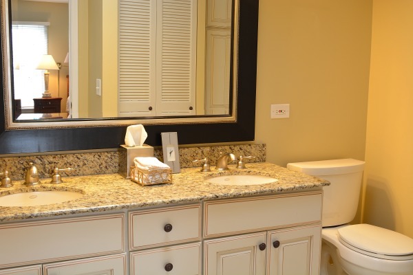 1833 Clover Road Northbrook, IL 60062 - Photo 19 of 25 a bathroom with a granite countertop sink and a toilet