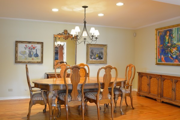 1833 Clover Road Northbrook, IL 60062 - Photo 5 of 25 a dining room with furniture a chandelier and wooden floor