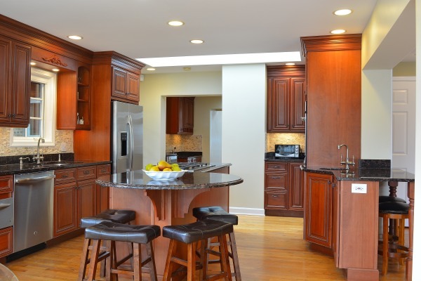 1833 Clover Road Northbrook, IL 60062 - Photo 7 of 25 a kitchen with stainless steel appliances kitchen island granite countertop a table and chairs in it