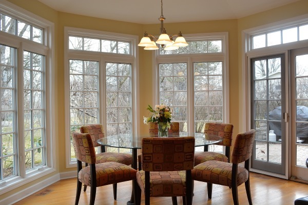 1833 Clover Road Northbrook, IL 60062 - Photo 9 of 25 a view of a dining room with furniture large windows and wooden floor