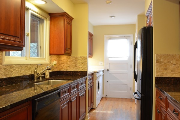 1833 Clover Road Northbrook, IL 60062 - Photo 10 of 25 a kitchen with granite countertop a sink and a refrigerator