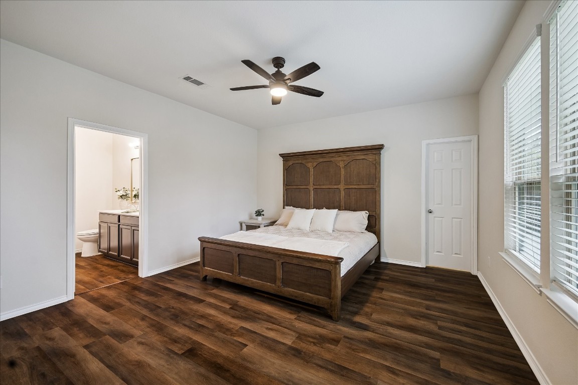 4275 Pine Still Road Conroe, TX 77304 - Photo 11 of 20 a spacious bedroom with a bed and a window