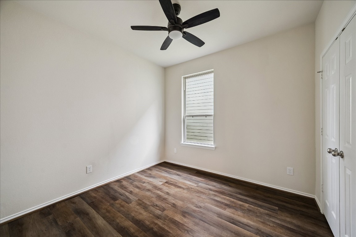 4275 Pine Still Road Conroe, TX 77304 - Photo 16 of 20 a view of empty room with wooden floor and fan