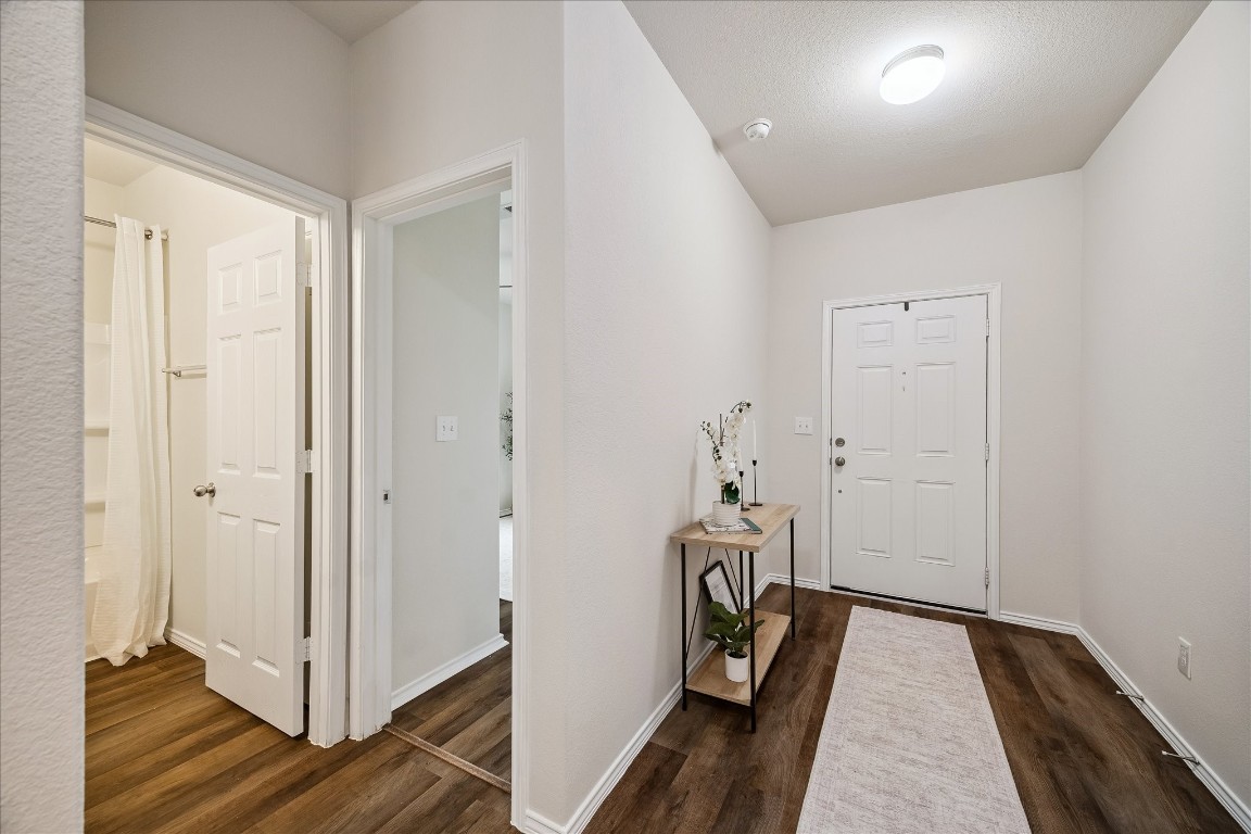 4275 Pine Still Road Conroe, TX 77304 - Photo 3 of 20 a view of a hallway with wooden floor