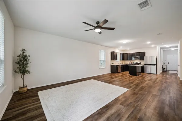 a view of kitchen with furniture and a chandelier