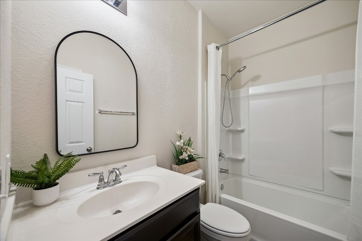 4275 Pine Still Road Conroe, TX 77304 - Photo 6 of 20 a bathroom with a sink toilet and shower