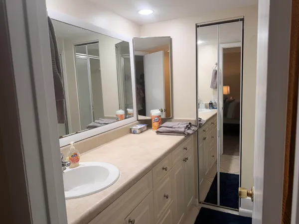 a bathroom with 2 sink and a mirror