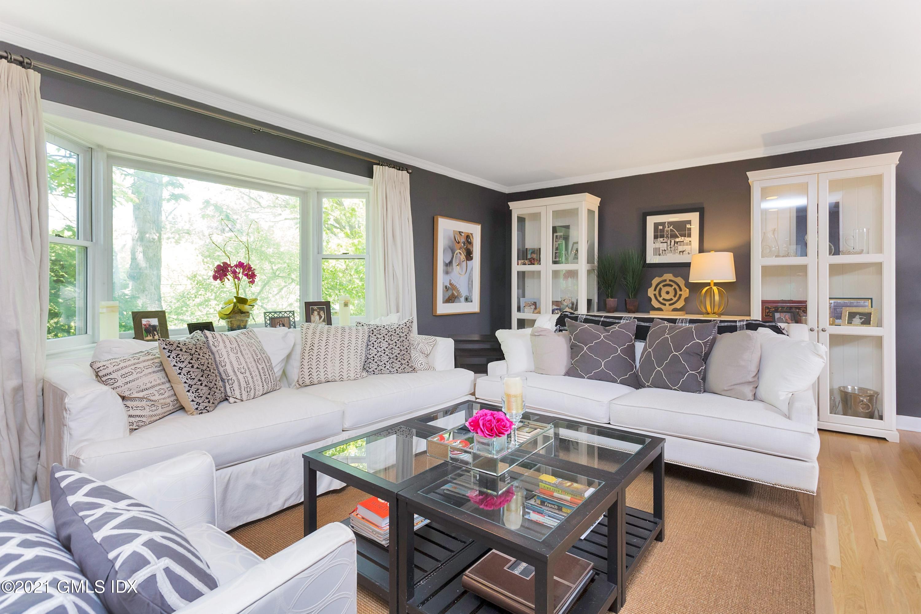 49 Sinawoy Road Cos Cob, CT 06807 - Photo 8 of 28 a living room with furniture and a large window