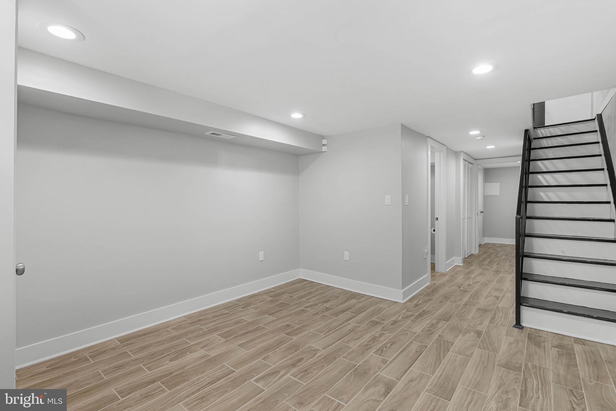 2639 Ellsworth Street Philadelphia, PA 19146 - Photo 17 of 20 a view of an empty room with wooden floor