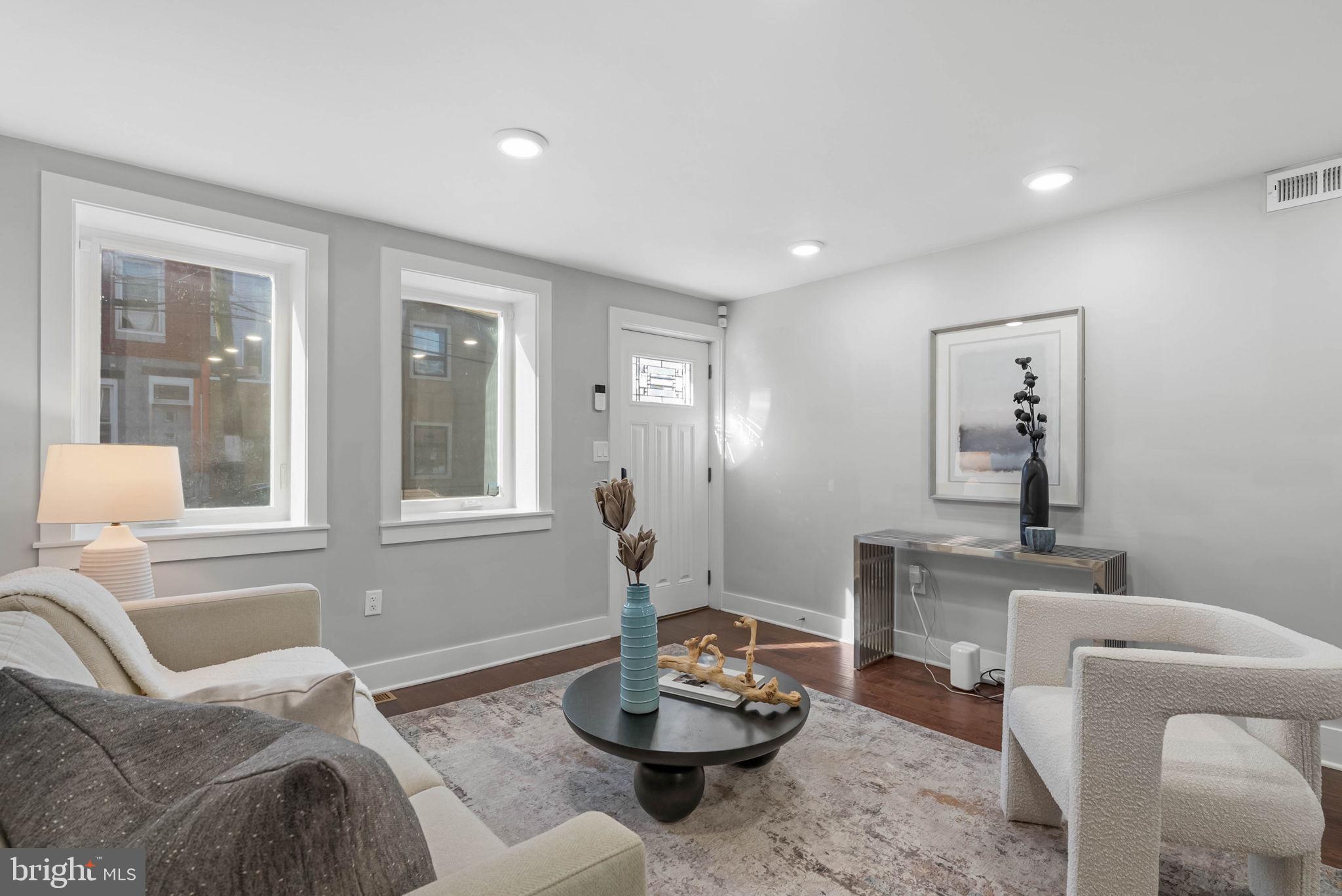 2639 Ellsworth Street Philadelphia, PA 19146 - Photo 6 of 20 a living room with furniture and a potted plant