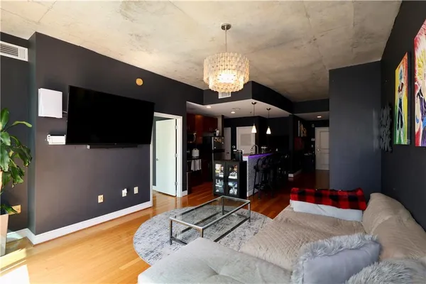 a bed room with a bed and a television