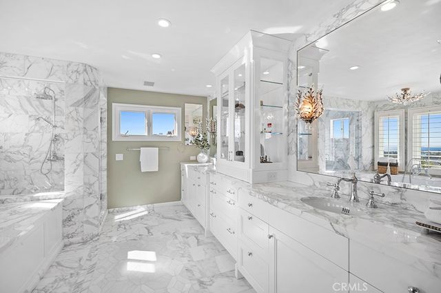 a bathroom with a granite countertop sink mirror and a