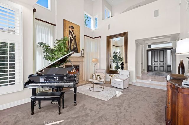 a livingroom with furniture and a floor to ceiling window