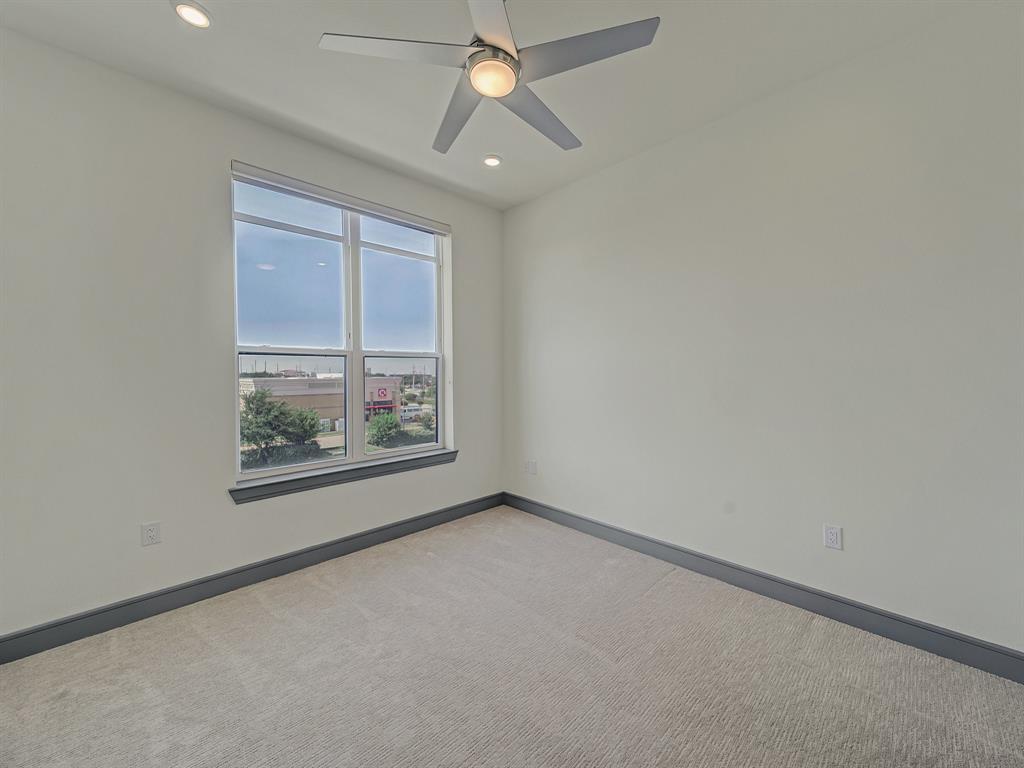 2700 Old Denton Road, Unit 3347 Carrollton, TX 75007 - Photo 11 of 30 an empty room with windows and fan