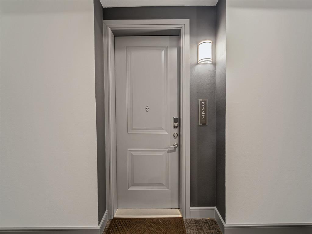 2700 Old Denton Road, Unit 3347 Carrollton, TX 75007 - Photo 19 of 30 a bathroom with a glass door shower