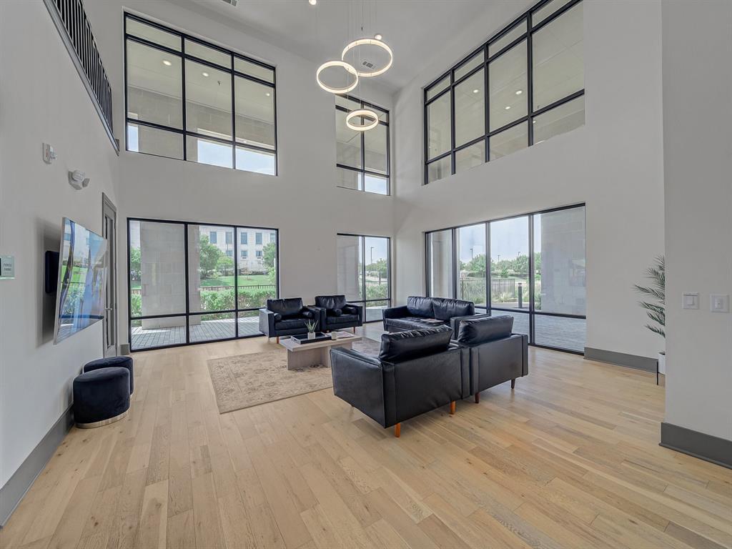 2700 Old Denton Road, Unit 3347 Carrollton, TX 75007 - Photo 24 of 30 a living room with furniture large window and flat screen tv