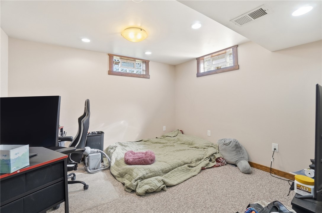1325 Chelsea Road Troy, OH 45373 - Photo 32 of 42 This versatile room offers flexible living options with warm lighting.