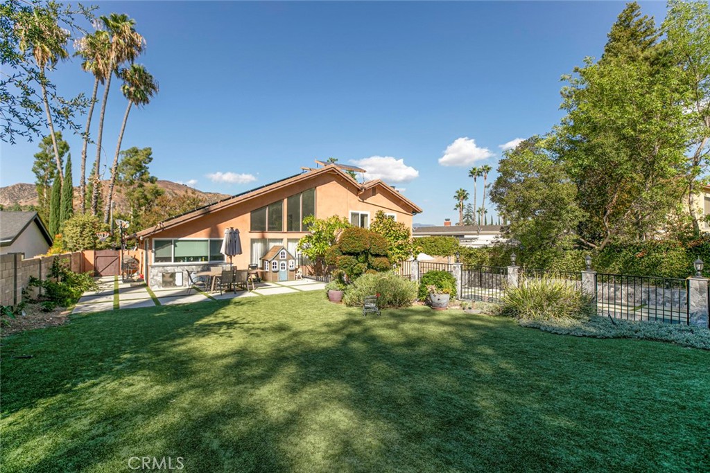 18810 Kirkcolm Lane Porter Ranch, CA 91326 - Photo 51 of 75 a view of a house with a yard