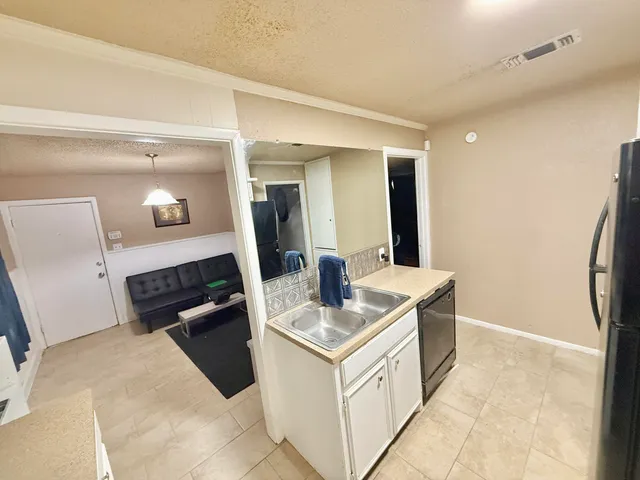 a view of living room with washer and dryer